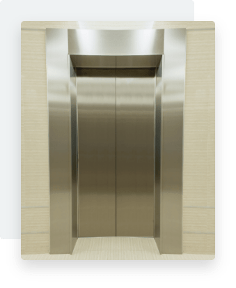 A silver lift with the doors closed